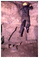 photo of caver climbing