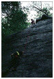 photo of caver on a technical rock climb